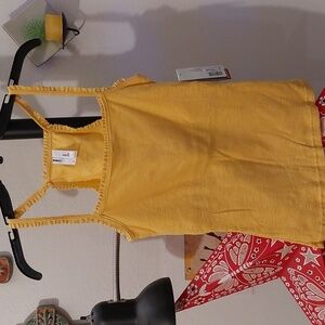 Super cute bright yellow racerback tank top with lace details and built in bra